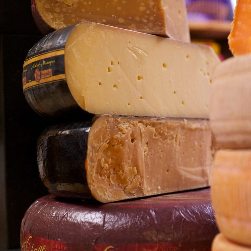 a stack of gouda cheese