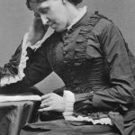 American Novelist Louisa May Alcott at a desk